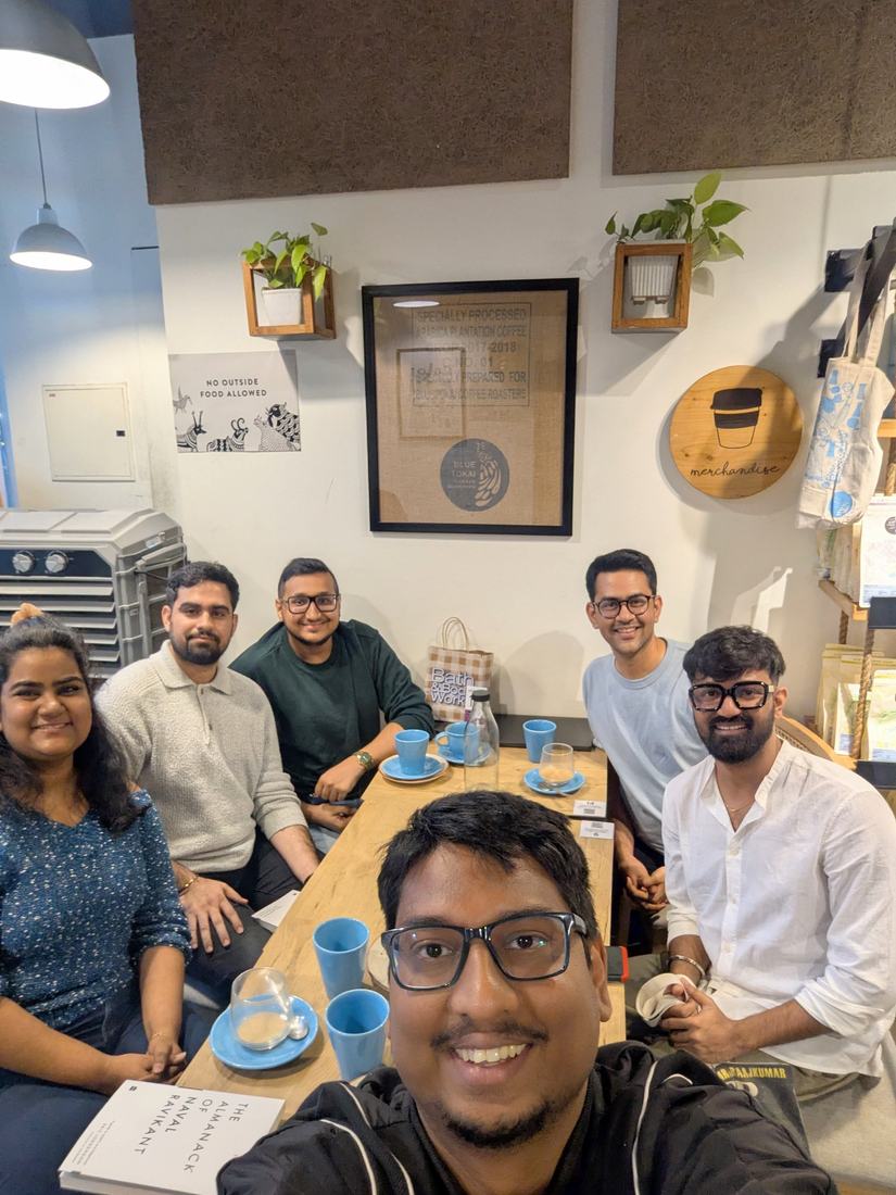 A small group around a cafe table