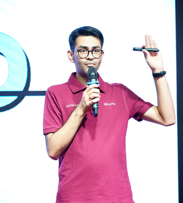 Aditya Maheshwari speaking on stage